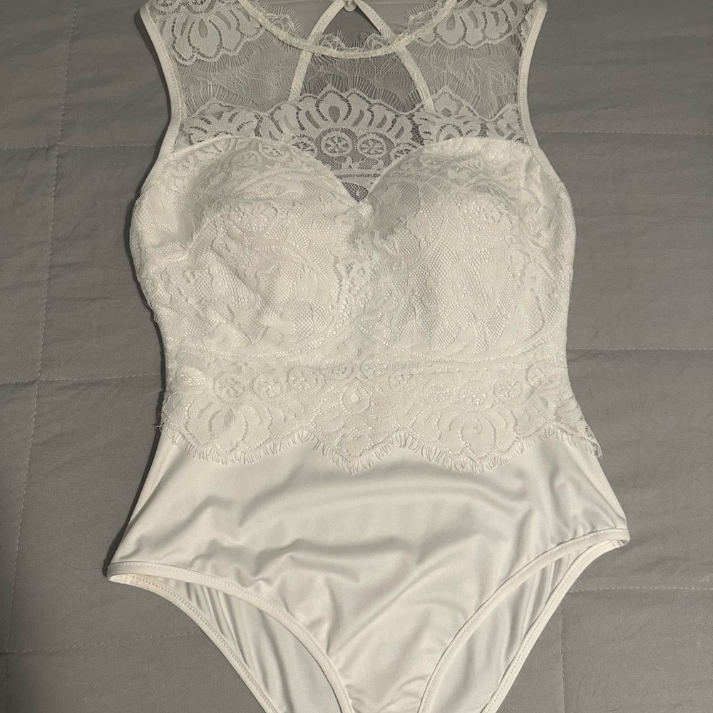 Lace white body suit. Size small, fits medium.